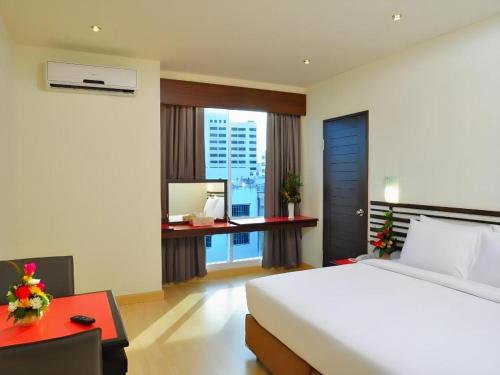 Postel nebo postele na pokoji v ubytování The Color Hotel