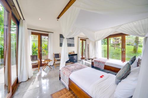 Postel nebo postele na pokoji v ubytování Awan Putih Resort