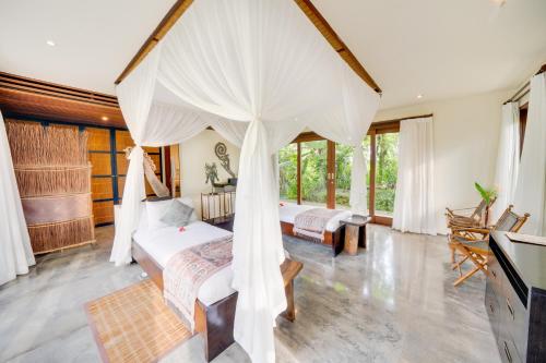 Postel nebo postele na pokoji v ubytování Awan Putih Resort