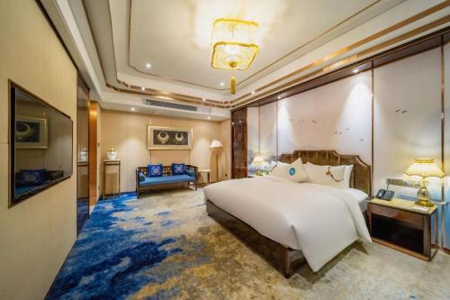 Katil atau katil-katil dalam bilik di Hou Yi Grand Hotel