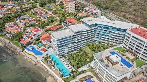 an aerial view of a resort near the ocean at Beachfront and modern getaway in Bucerías