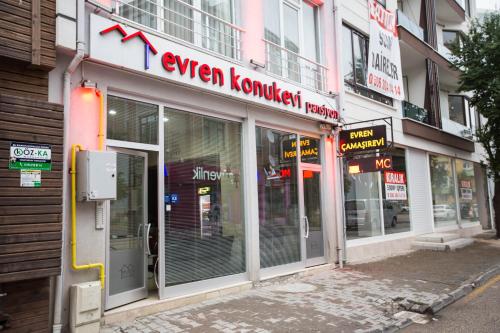 a store front with a sign for an open korean korean restaurant at Evren Konukevi Pansiyon in Bolu