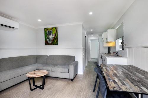 a living room with a couch and a table at Ingenia Holidays Townsville in Townsville