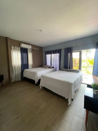 Un ou plusieurs lits dans un hébergement de l'établissement Casa Blue in Masca Omoa