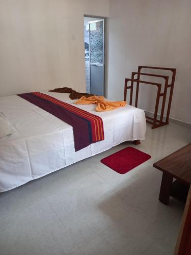 a bedroom with a bed with a blanket on it at New Forest Glen Nest in Ella