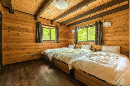 Un pat sau paturi într-o cameră la Nasu Designer's Villa - Vacation STAY 13207