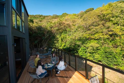 a group of people sitting at a table on a deck at Awaji-shima C-Side Dual View - Vacation STAY 88182v in Minamiawaji