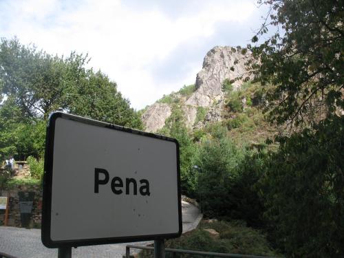 a sign that says pana in front of a mountain at Casa da Cerejinha in Góis