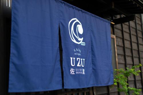 a blue banner with the words u on it at guesthouse UZU Sado - Vacation STAY 01109v in Sado
