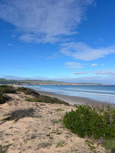 a view of a beach with the ocean at Magpie Sands - Ocean Views & Seaside Luxury - Steps to beach in Aldinga Beach