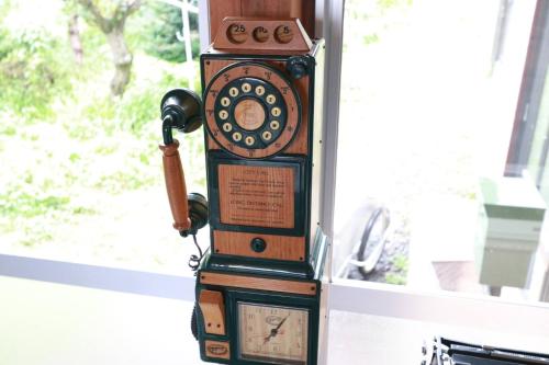 an old fashioned telephone sitting next to a window at Tsuru BASE - Vacation STAY 12709v in Tsuru 