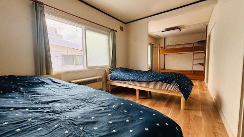 Ένα ή περισσότερα κρεβάτια σε δωμάτιο στο secondhouse - Vacation STAY 80543v