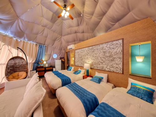 a bedroom with three beds in a dome ceiling at Mt,Fuji Glamping Terrace Minenohana - Vacation STAY 35718v in Oishi