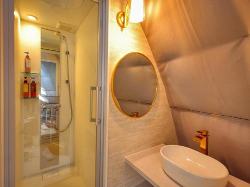 a bathroom with a sink and a shower and a mirror at Mt,Fuji Glamping Terrace Minenohana - Vacation STAY 35071v in Oishi
