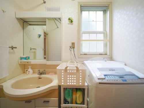 a small bathroom with a sink and a sink at Nasu-gun - House - Vacation STAY 13449 in Nasu-yumoto