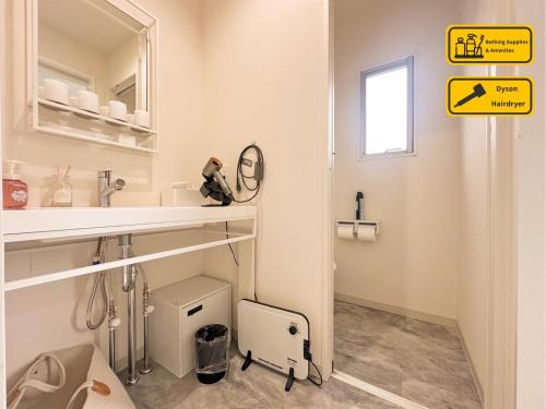 a bathroom with a sink and a mirror at Nekoana Glamping - Vacation STAY 39635v in Fujikawaguchiko