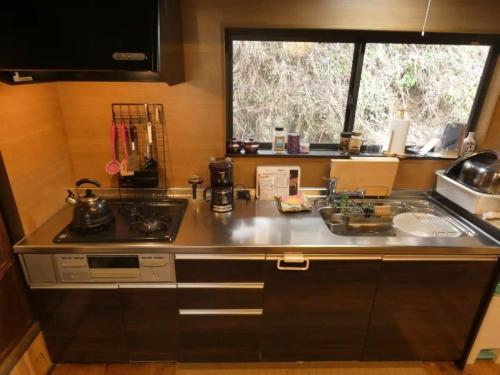 a kitchen counter with a sink and a window at Shikouan - Vacation STAY 55494v in Higashi-shibuta