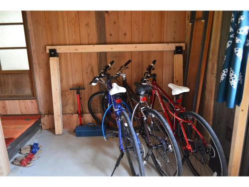 two bikes are parked in a garage at Shikouan - Vacation STAY 55494v in Higashi-shibuta
