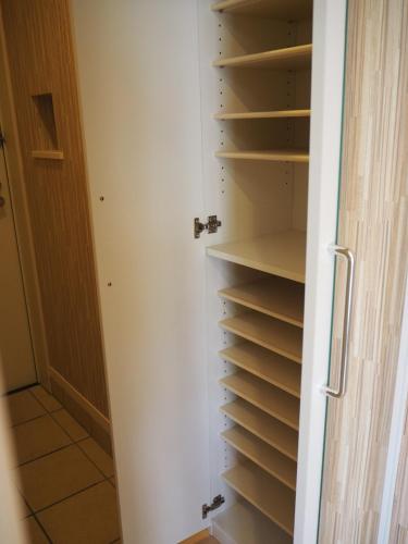a closet with empty shelves in a room at Harbor City Terrace 202 - Vacation STAY 13565 in Higashi-horidōri