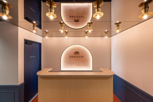 a room with a counter with lights on it at HOTEL KOMACHI TOKYO Higashi Nippori in Tokyo