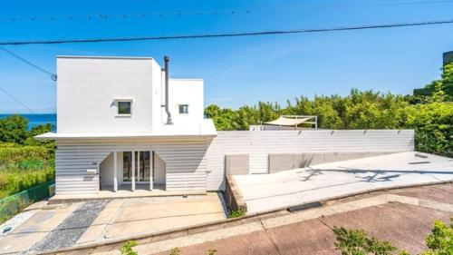 a white house with a driveway in front of it at NE-2930 - Vacation STAY 68092v in Awaji