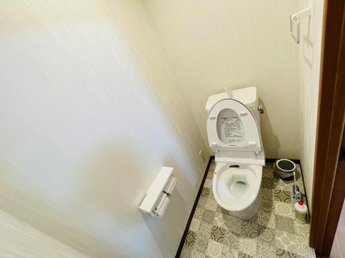 a small bathroom with a toilet with its seat up at FUKUINN - Vacation STAY 34537v in Takamatsu