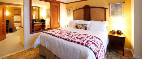 a bedroom with a large bed in a room at Aulani, Disney Vacation Club Villas in Kapolei