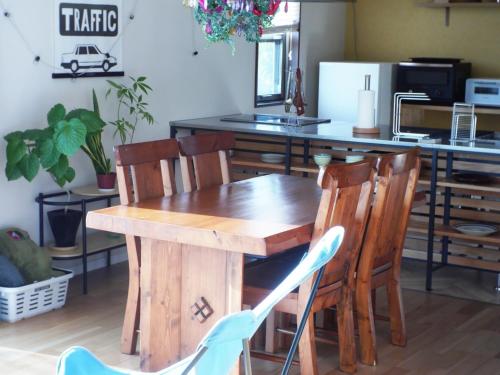 a wooden table and chairs in a kitchen at Goto - House - Vacation STAY 66191v in Goto