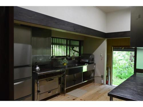a kitchen with a sink and a stove at Suian - Vacation STAY 55562v in Higashi-shibuta