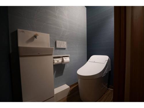 a small bathroom with a toilet and a sink at YAKATA - Vacation STAY 58651v in Yuzawa