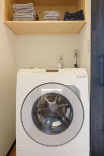a washing machine with a wheel on top of it at Private inn Mei Vacation Rental MEI - Vacation STAY 57858v in Ino