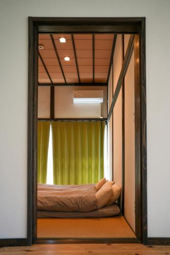 a bed in a room with a window at Private inn Mei Vacation Rental MEI - Vacation STAY 57858v in Ino