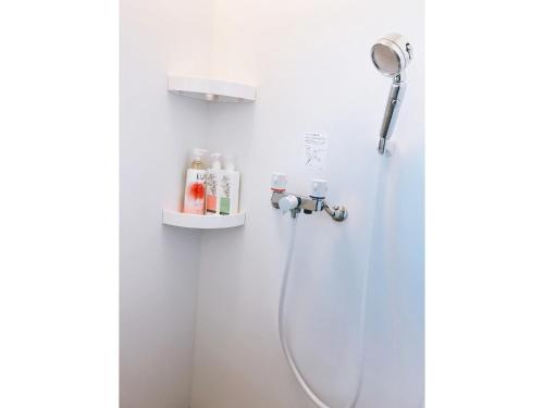 a shower with a shower head in a bathroom at Guest House SAKURA - Vacation STAY 57751v in Sakura