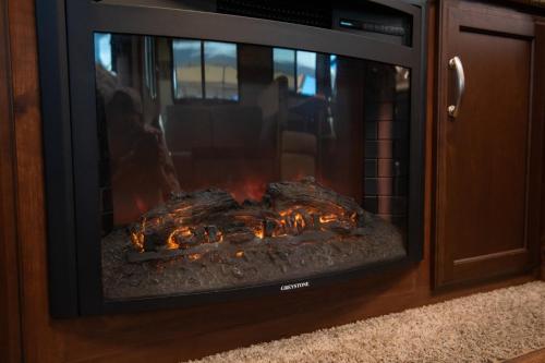 a fire in a fireplace in a living room at Private Villa 405 - Vacation STAY 66258v in Shushi