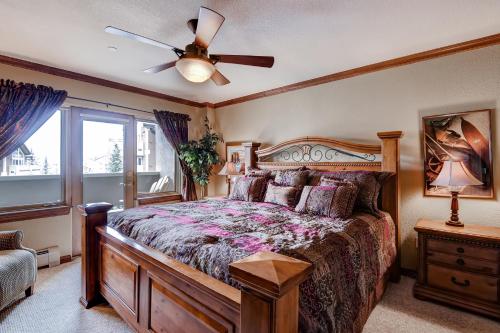 a bedroom with a bed and a ceiling fan at St. James Place in Beaver Creek