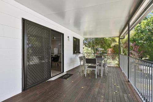 a balcony with a table and chairs on it at Ingenia Holidays Townsville in Townsville