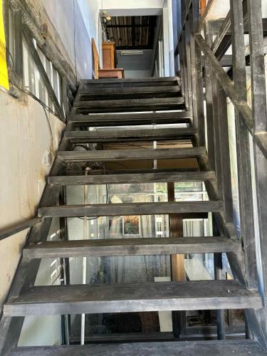 a set of stairs in a building at The Sunshine hostel and hotel in Ko Lanta