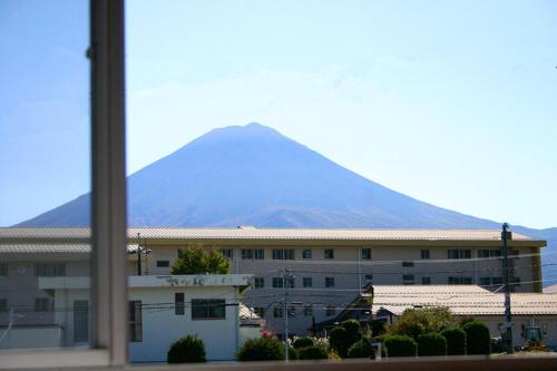 a building with a mountain in the background at RETRO retro - Vacation STAY 95757v in Azagawa
