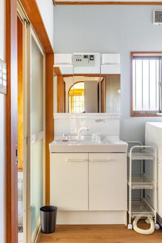 a kitchen with white cabinets and a sink at Nasu Grand Villa - Vacation STAY 13860 in Nasu-yumoto