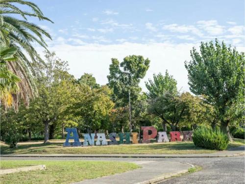 a sign for a park with trees in the background at Minpaku Yamamoto - Vacation STAY 13869 in Izumiotsu