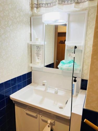 a bathroom with a white sink and a mirror at FUKUINN - Vacation STAY 19245v in Takamatsu
