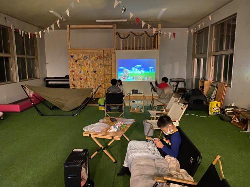 a living room with people playing a video game at Nagatanchi - Vacation STAY 19913v in Mimata
