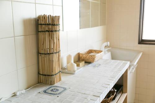 a bathroom with a white tiled counter and a tub at VillageOMOYA - Vacation STAY 24662v in Ina