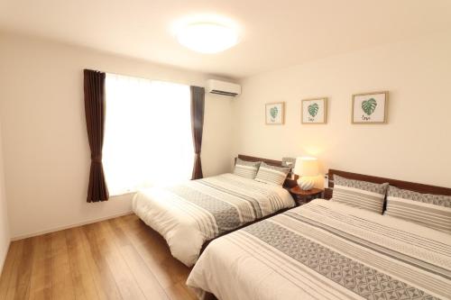 Postel nebo postele na pokoji v ubytování Grandmer Oyakawa - Vacation STAY 18394v