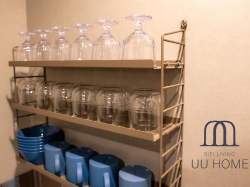 a bunch of wine glasses sitting on a shelf at UU HOME - Vacation STAY 28498v in Biei