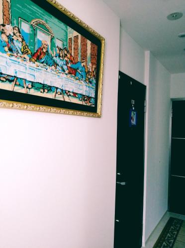 a painting hanging on a wall next to a door at Tokyo stay Hut SARI - Vacation STAY 27239v in Tokyo