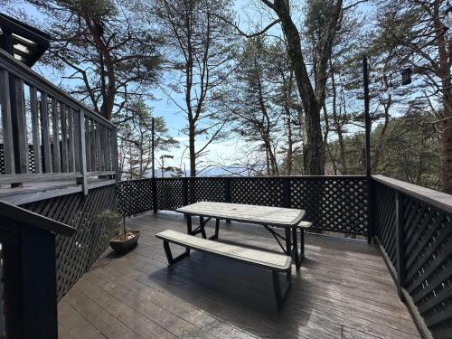 a picnic table and a bench on a deck at Agatsuma-gun - House - Vacation STAY 26682v in Kusatsu