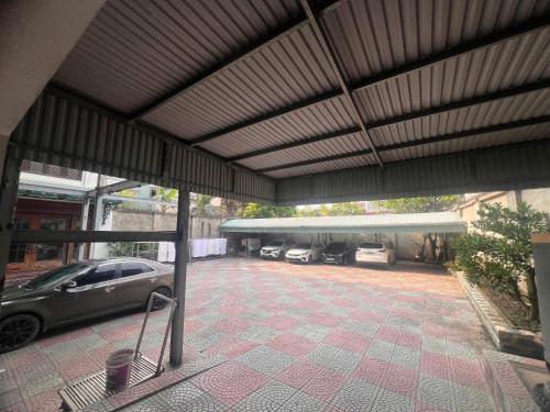 a parking lot with cars parked in a garage at Sao Mai in Hai Phong