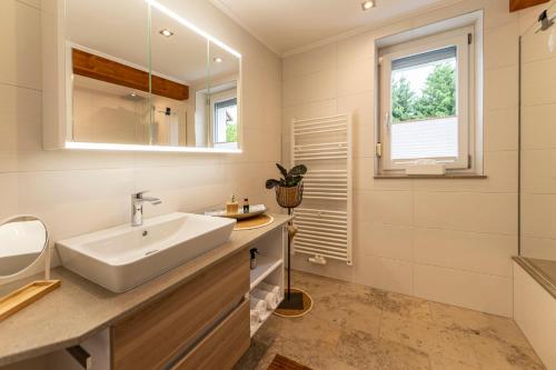 Ένα μπάνιο στο Ferienwohnung Putzer