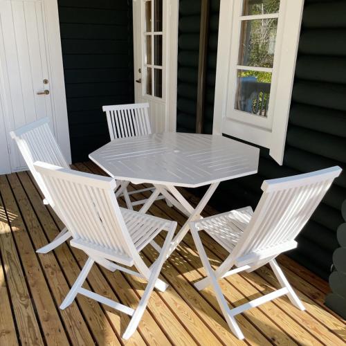 a white table and chairs on a porch at 'OLI' OLI tree - Vacation STAY 39608v in Takashima